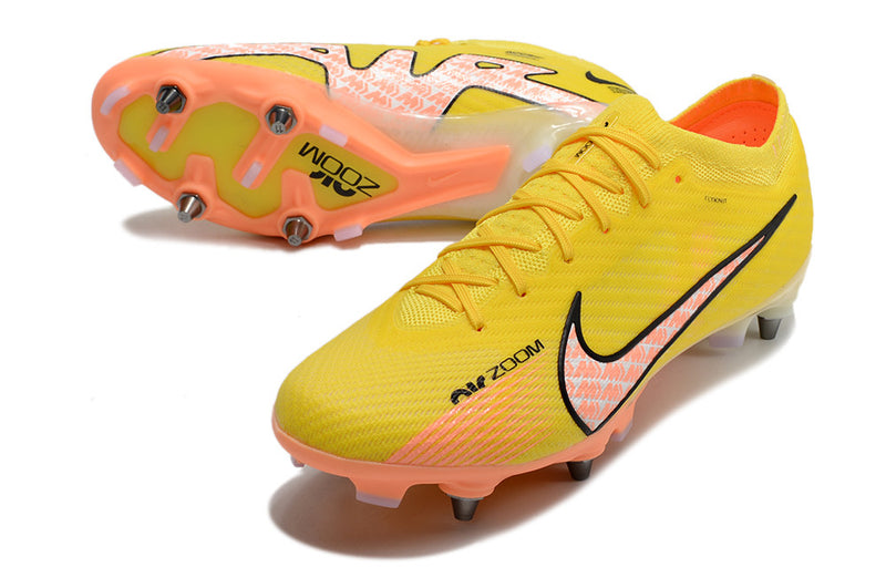 CHUTEIRA NIKE MERCURIAL VAPOR 15 ELITE TRAVA DE ALUMINIO CAMPO+BRINDE