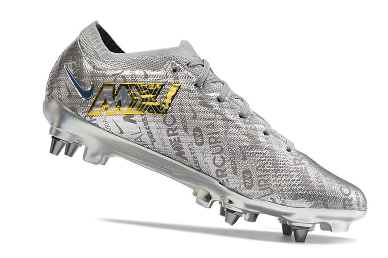 CHUTEIRA NIKE MERCURIAL VAPOR 15 ELITE TRAVA DE ALUMINIO CAMPO+BRINDE