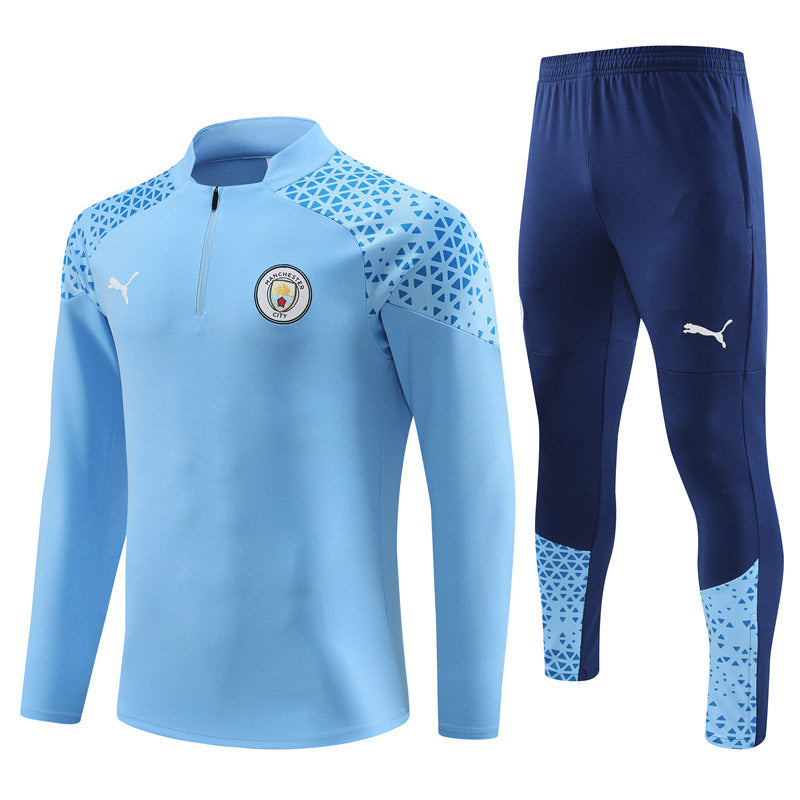 KIT CONJUNTO MEIO ZIPER MANCHESTER CITY 23/24